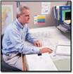Photo of Man with Construction Plans